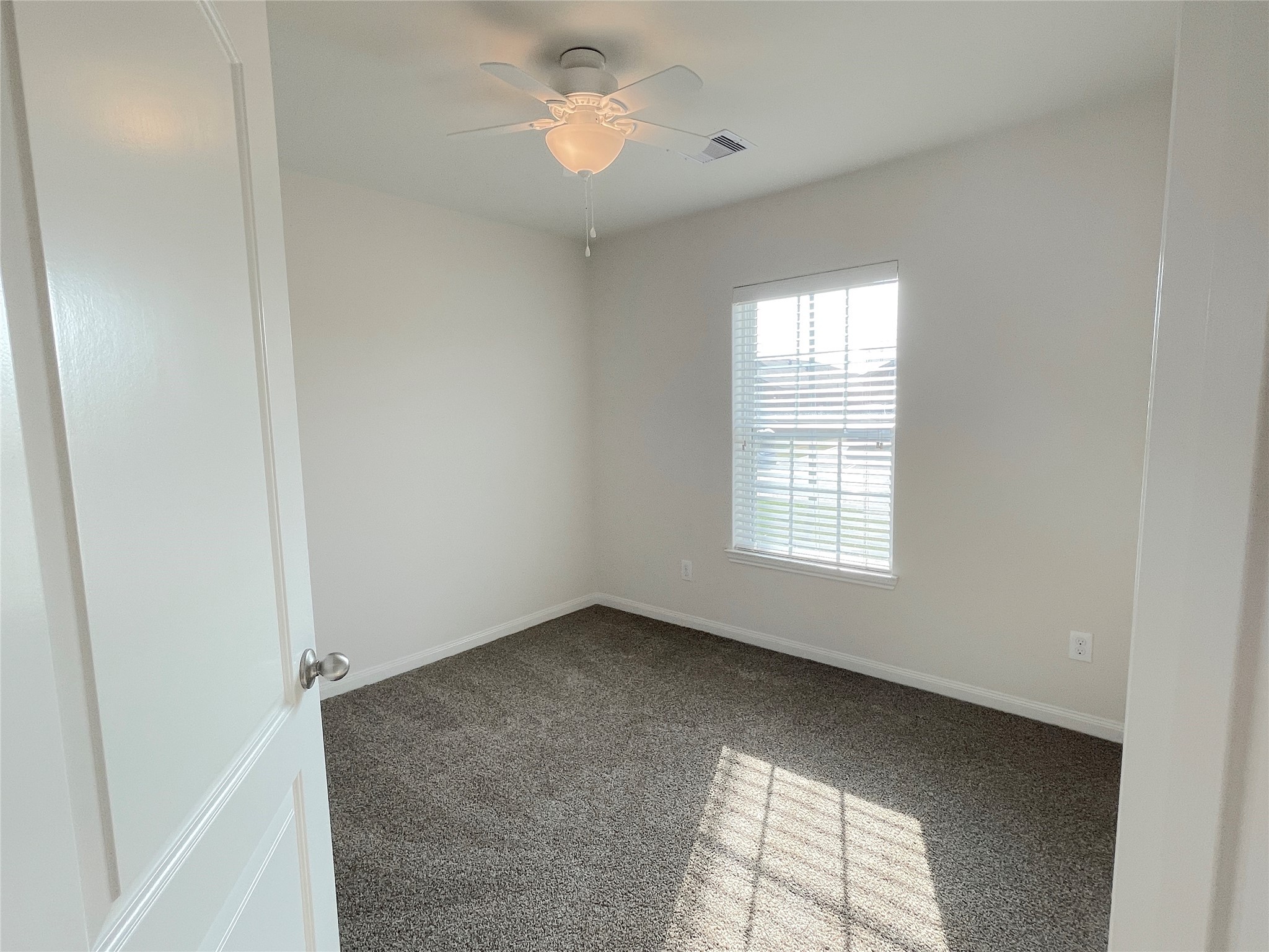 20714 Round Key Drive Hockley, TX 77447 - Photo 3 of 20 a view of an empty room with a window