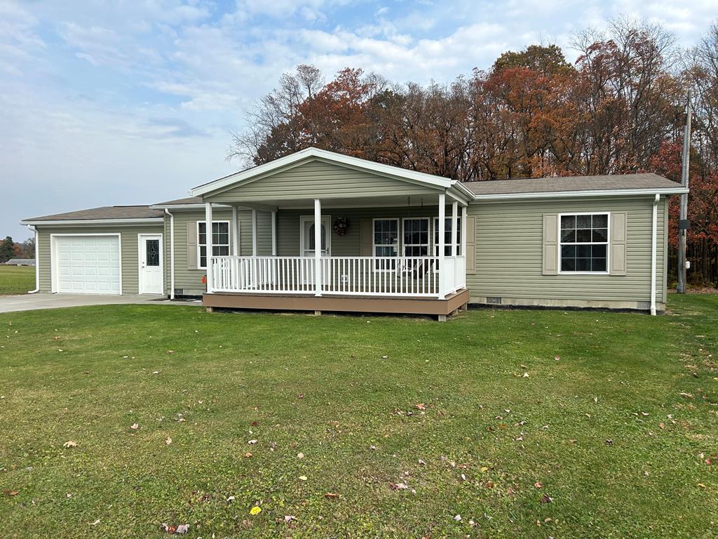 927 Lawsonham Road Rimersburg, PA 16248 - Photo 1 of 33 a front view of a house with a garden