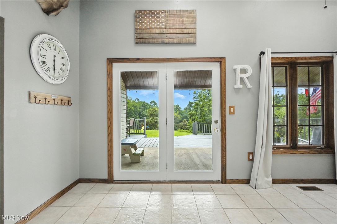 1371 Spider Ridge Road Parkersburg, WV 26104 - Photo 9 of 48 Doorway with baseboards and light tile patterned floors