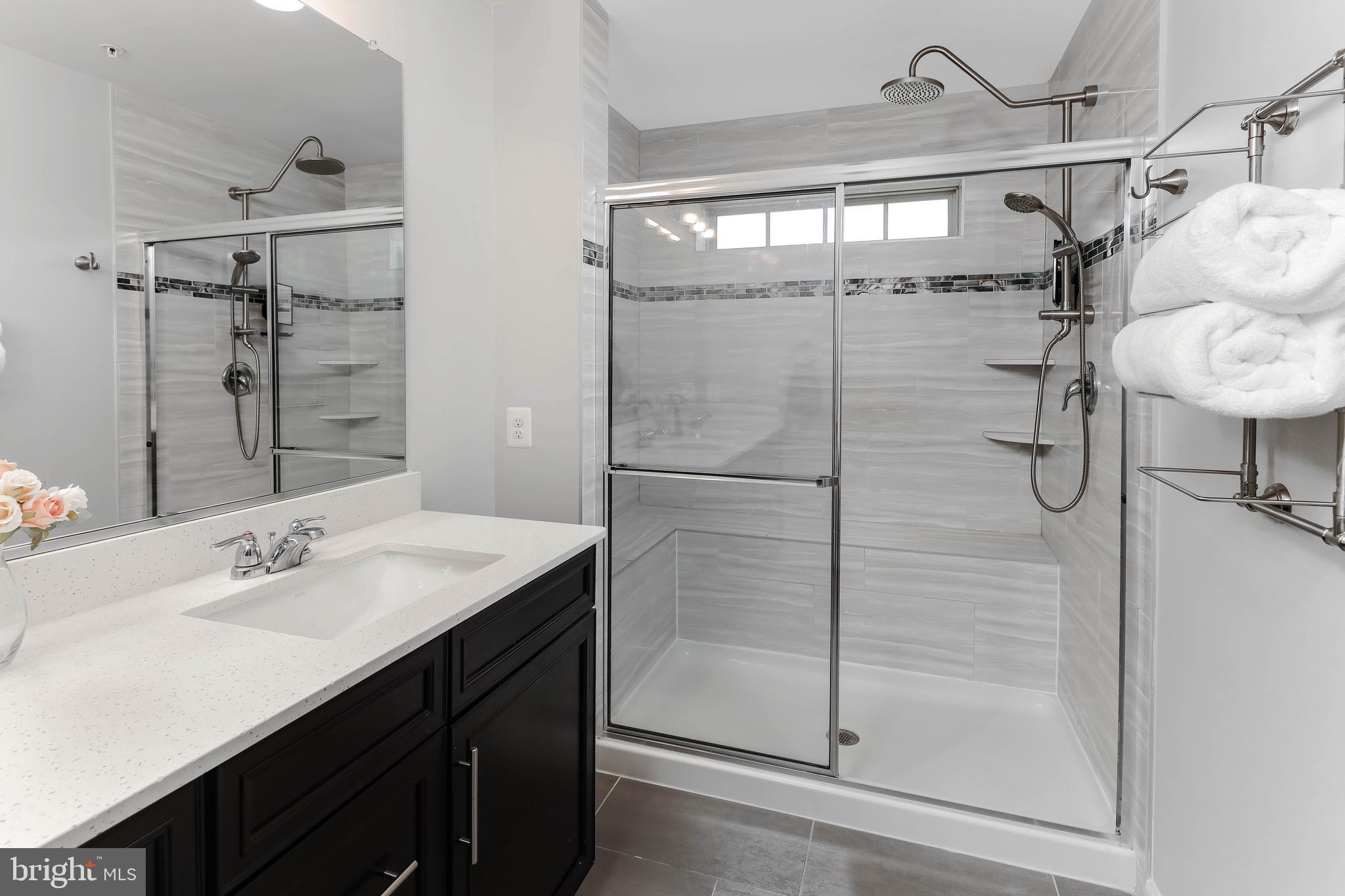 3048 Bretons Ridge Way Hanover, MD 21076 - Photo 20 of 34 Owner's bath has super-shower with L-shaped bench!