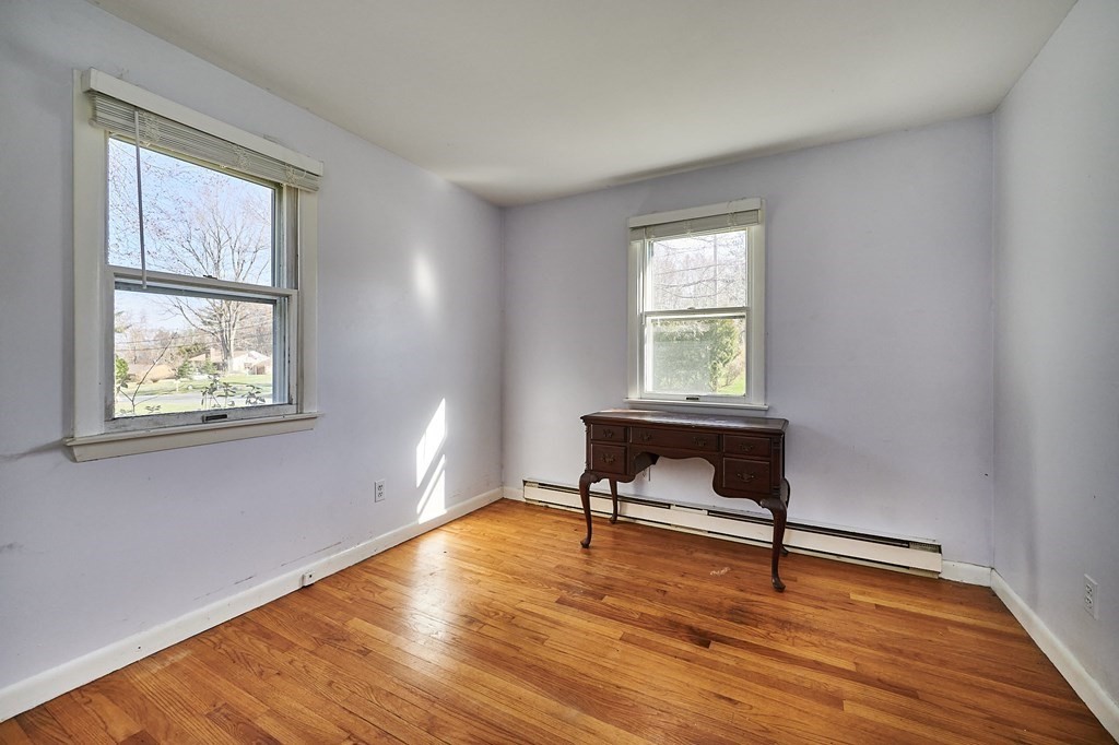 317 Florence Road Northampton, MA 01062 - Photo 14 of 38 a view of an empty room with wooden floor and a window