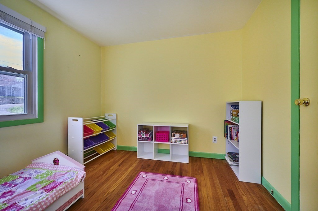 317 Florence Road Northampton, MA 01062 - Photo 16 of 38 a living room with baby crib furniture and a baby crib