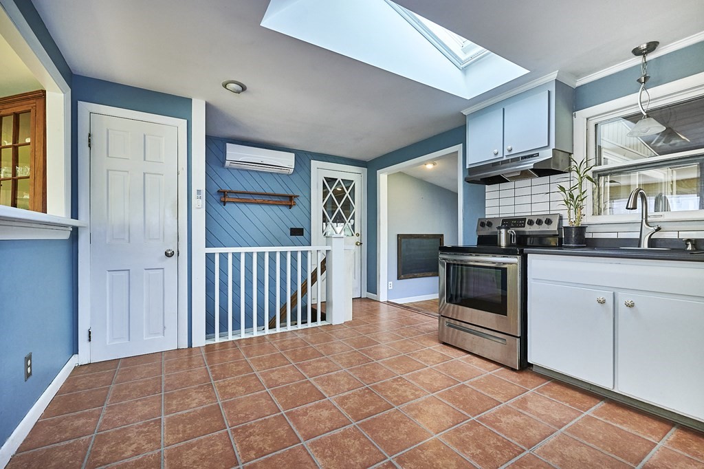 317 Florence Road Northampton, MA 01062 - Photo 7 of 38 a kitchen with stainless steel appliances granite countertop a stove a sink and a refrigerator