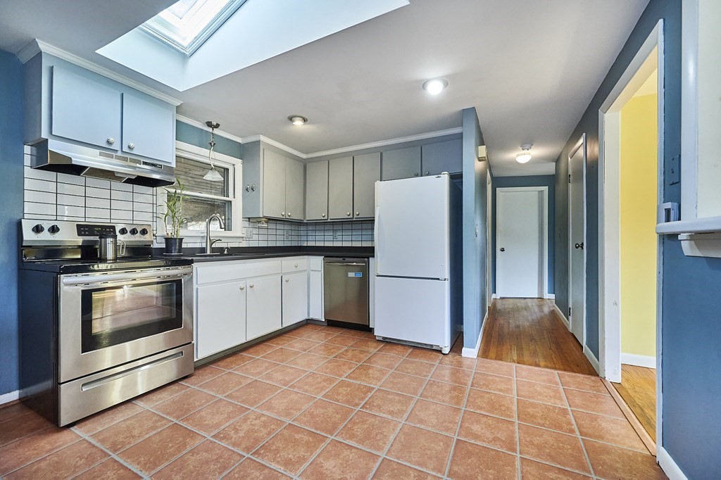 317 Florence Road Northampton, MA 01062 - Photo 8 of 38 a kitchen with a refrigerator a stove top oven a sink and cabinets