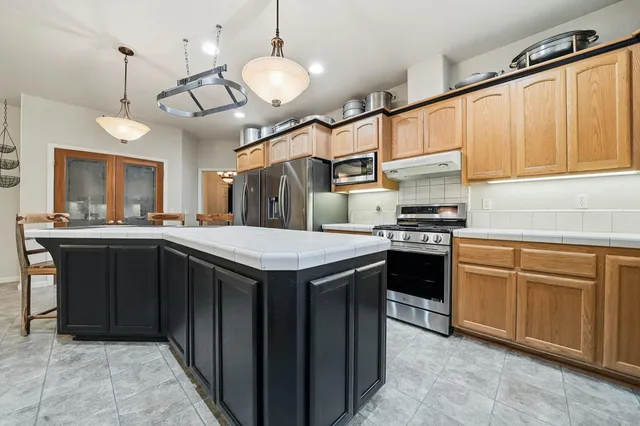 a bedroom with a bed and a desk