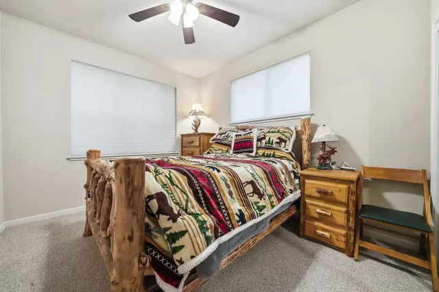 a bedroom with a bed and a dresser