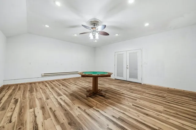 a view of a house with a wooden fence