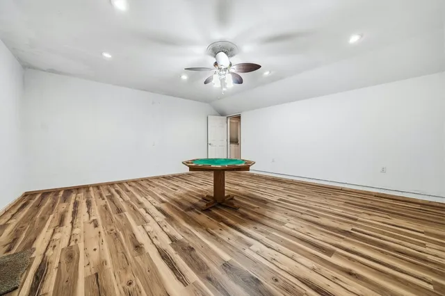 a view of a house with a small deck