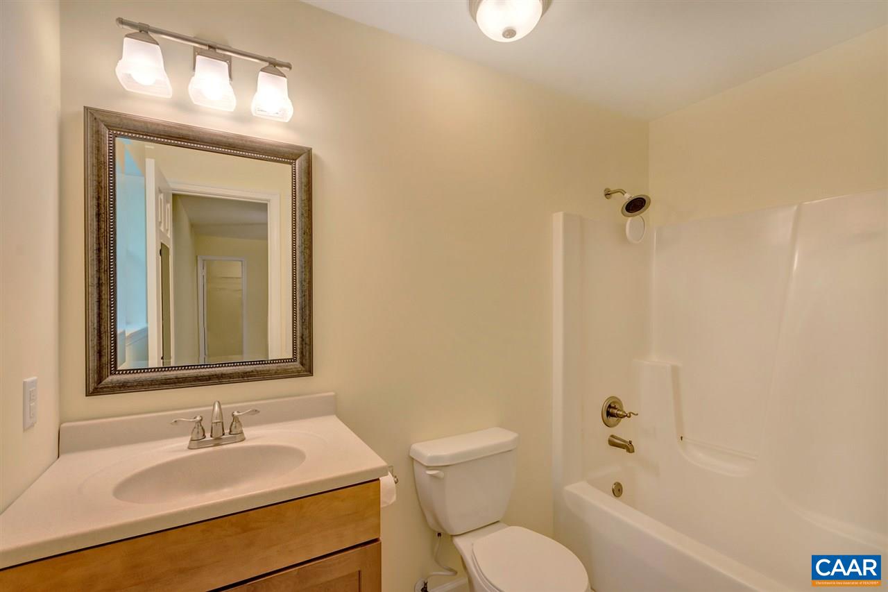 67 Amethyst Road Palmyra, VA 22963 - Photo 11 of 33 a bathroom with a toilet sink vanity tub and mirror