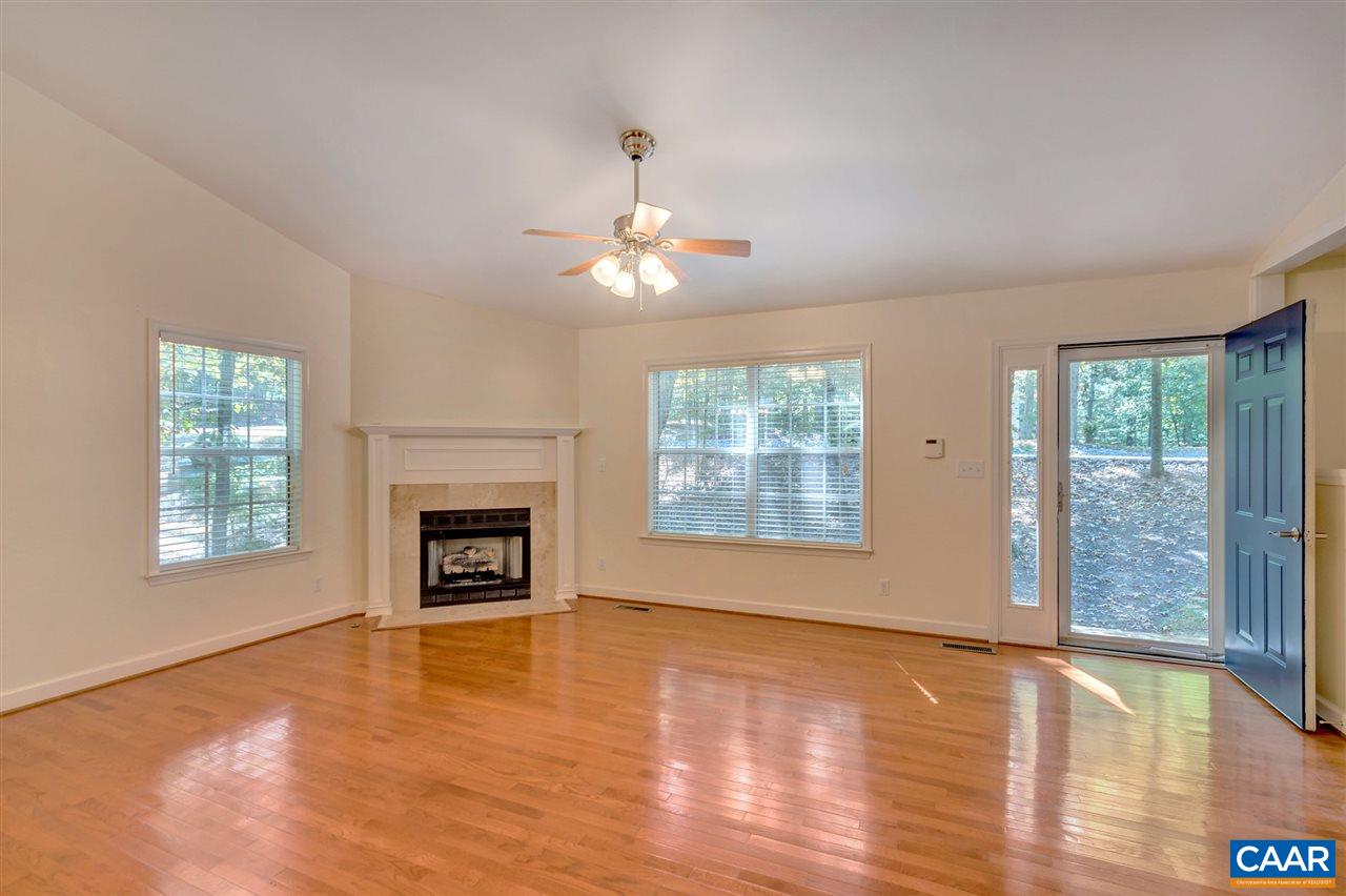 67 Amethyst Road Palmyra, VA 22963 - Photo 3 of 33 wooden floor fireplace and windows in an empty room