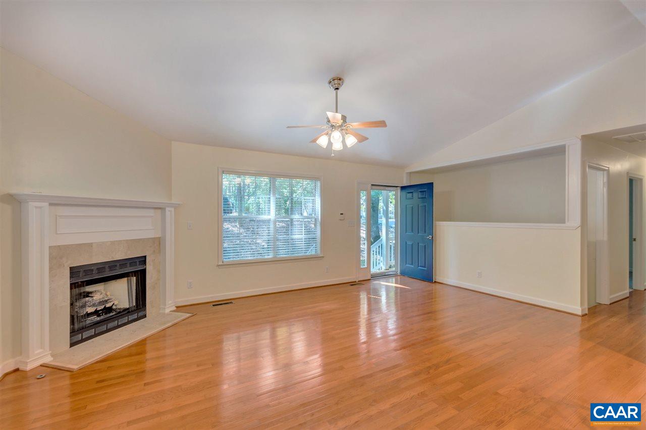 67 Amethyst Road Palmyra, VA 22963 - Photo 4 of 33 an empty room with windows and fireplace