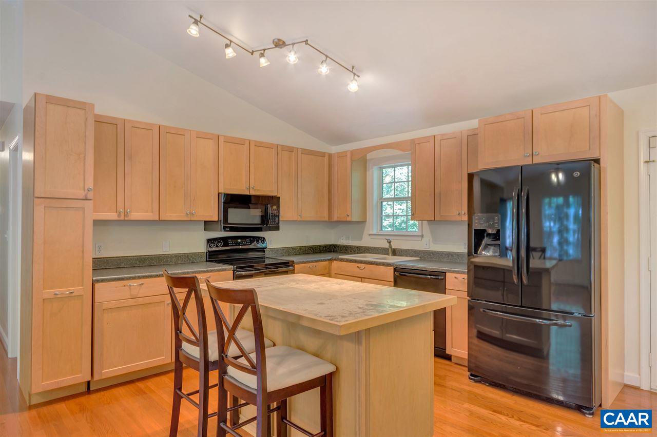 67 Amethyst Road Palmyra, VA 22963 - Photo 7 of 33 a kitchen with a refrigerator and a stove top oven