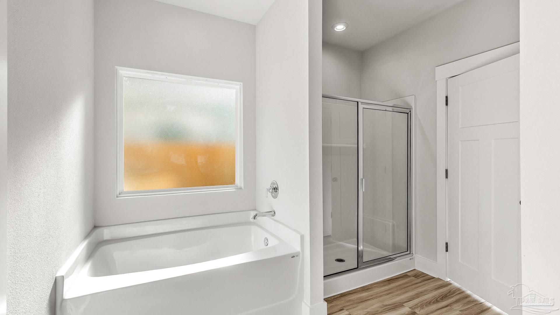 3412 Crossvine Road Cantonment, FL 32533 - Photo 19 of 42 a bathroom with a bathtub and shower