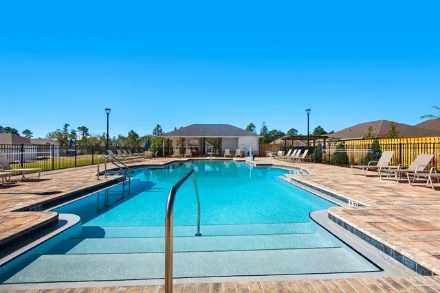 a view of a swimming pool with a lounge chair