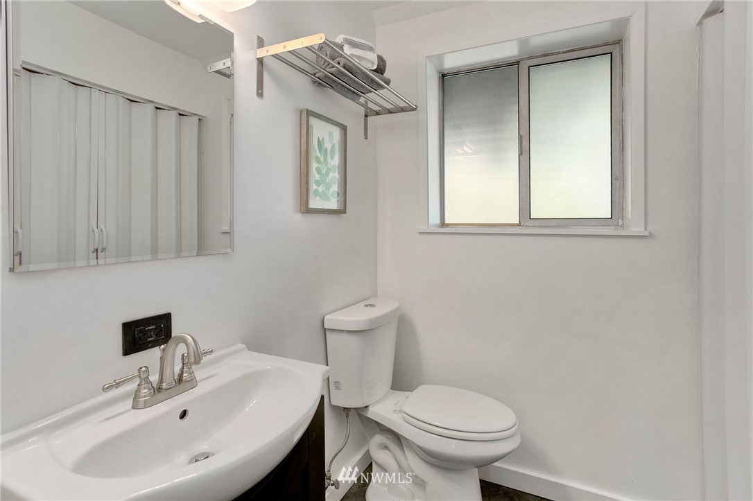 24232 24th Avenue West Bothell, WA 98021 - Photo 22 of 30 a bathroom with a sink a toilet and a mirror