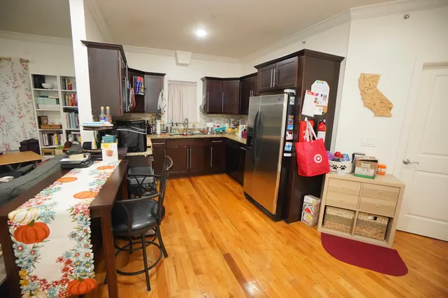 a kitchen view with table and chairs