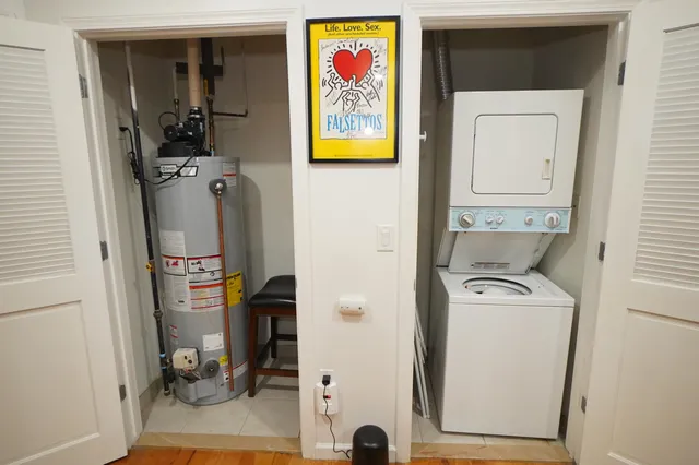 a utility room with dryer washer and closet