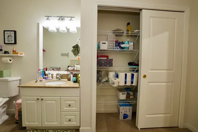 a kitchen with a refrigerator and cabinets