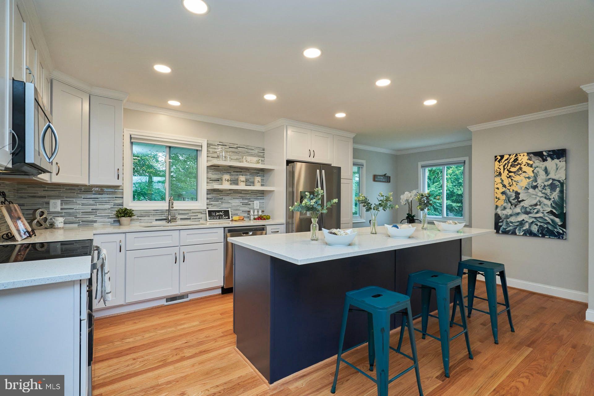 7422 Fordson Road Alexandria, VA 22306 - Photo 10 of 34 Tastefully done in navy blue center island