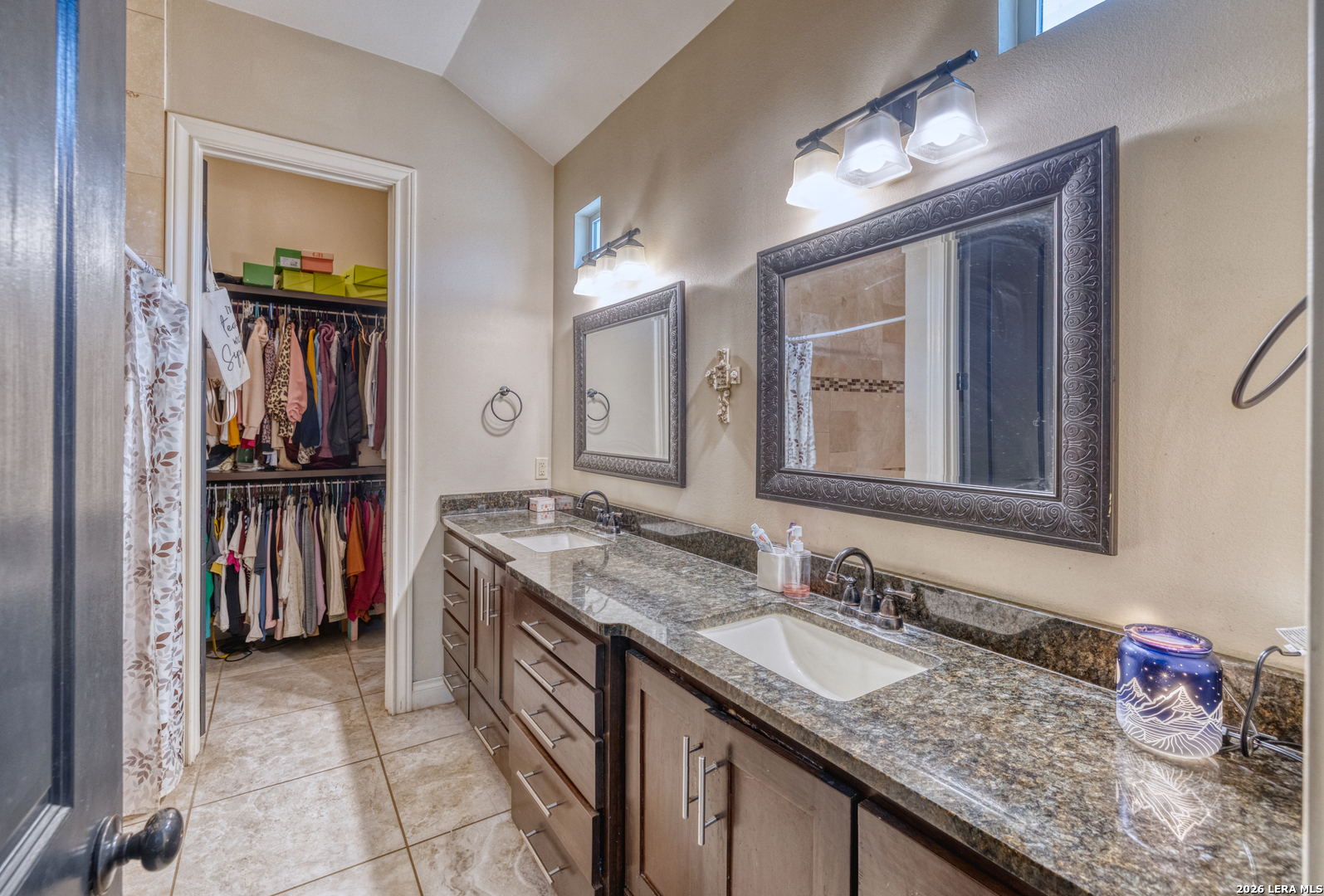 137 Sutton Place Uvalde, TX 78801 - Photo 20 of 31 a bathroom with a granite countertop sink and a mirror