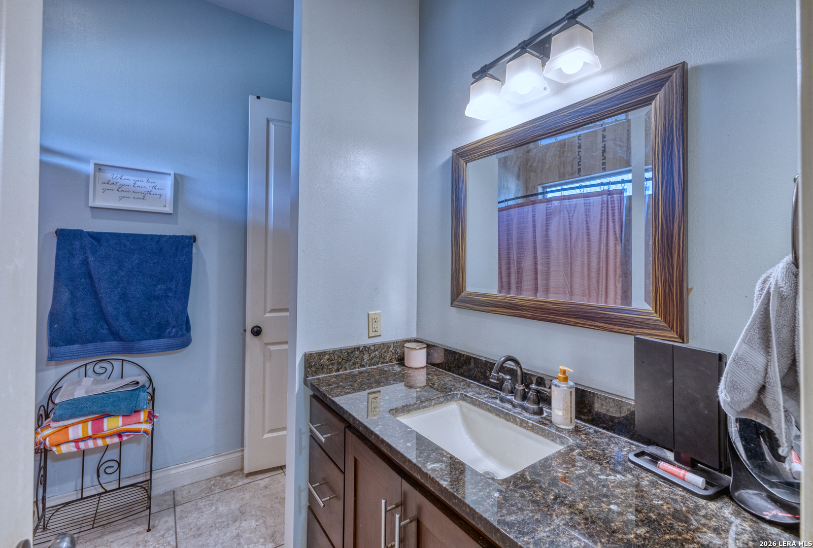 137 Sutton Place Uvalde, TX 78801 - Photo 25 of 31 a bathroom with a sink and a mirror
