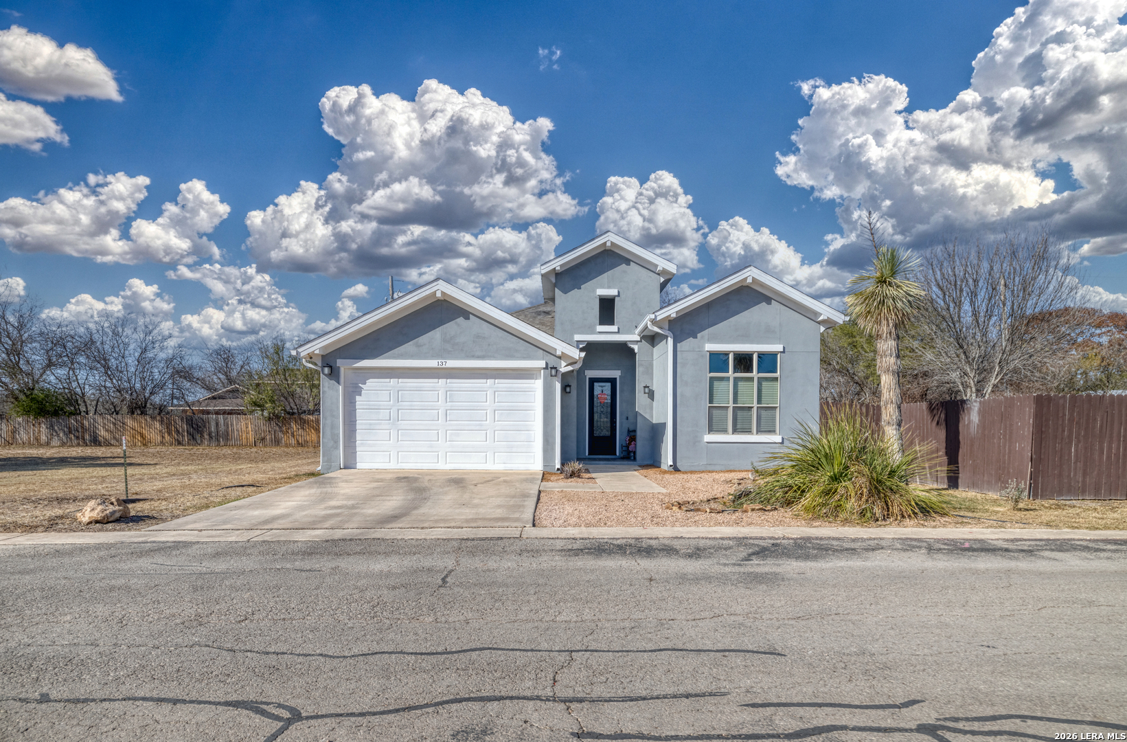 137 Sutton Place Uvalde, TX 78801 - Photo 3 of 31 a view of a house with a yard