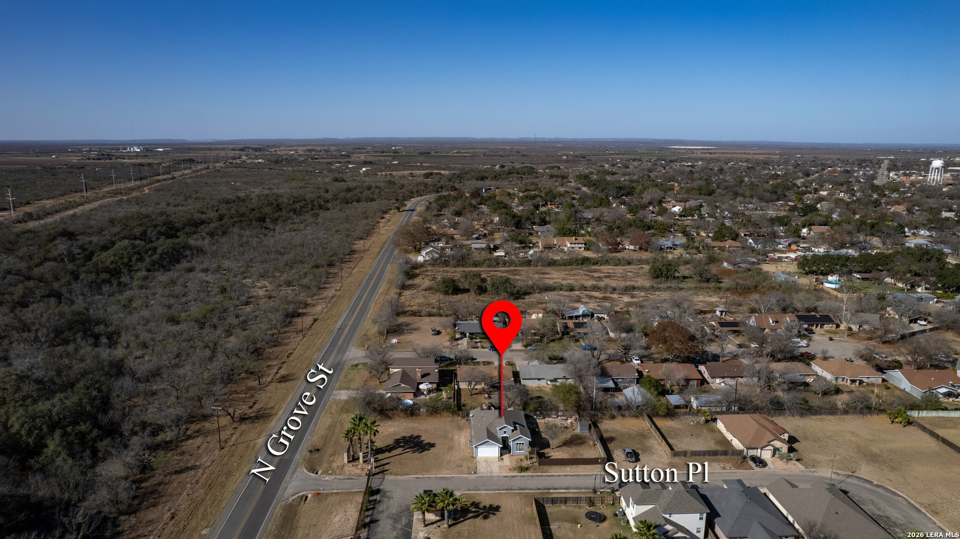 137 Sutton Place Uvalde, TX 78801 - Photo 31 of 31 an aerial view of a houses with a yard