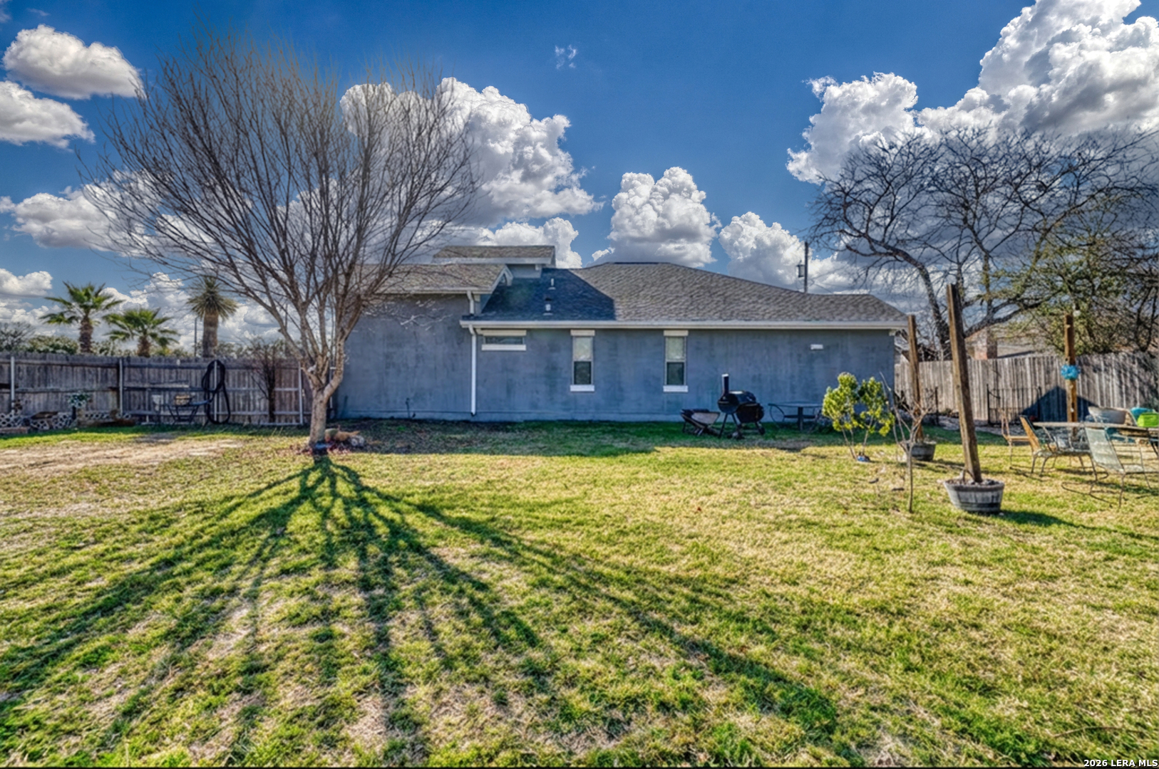 137 Sutton Place Uvalde, TX 78801 - Photo 8 of 31 a house view with a swimming pool and trees in the background