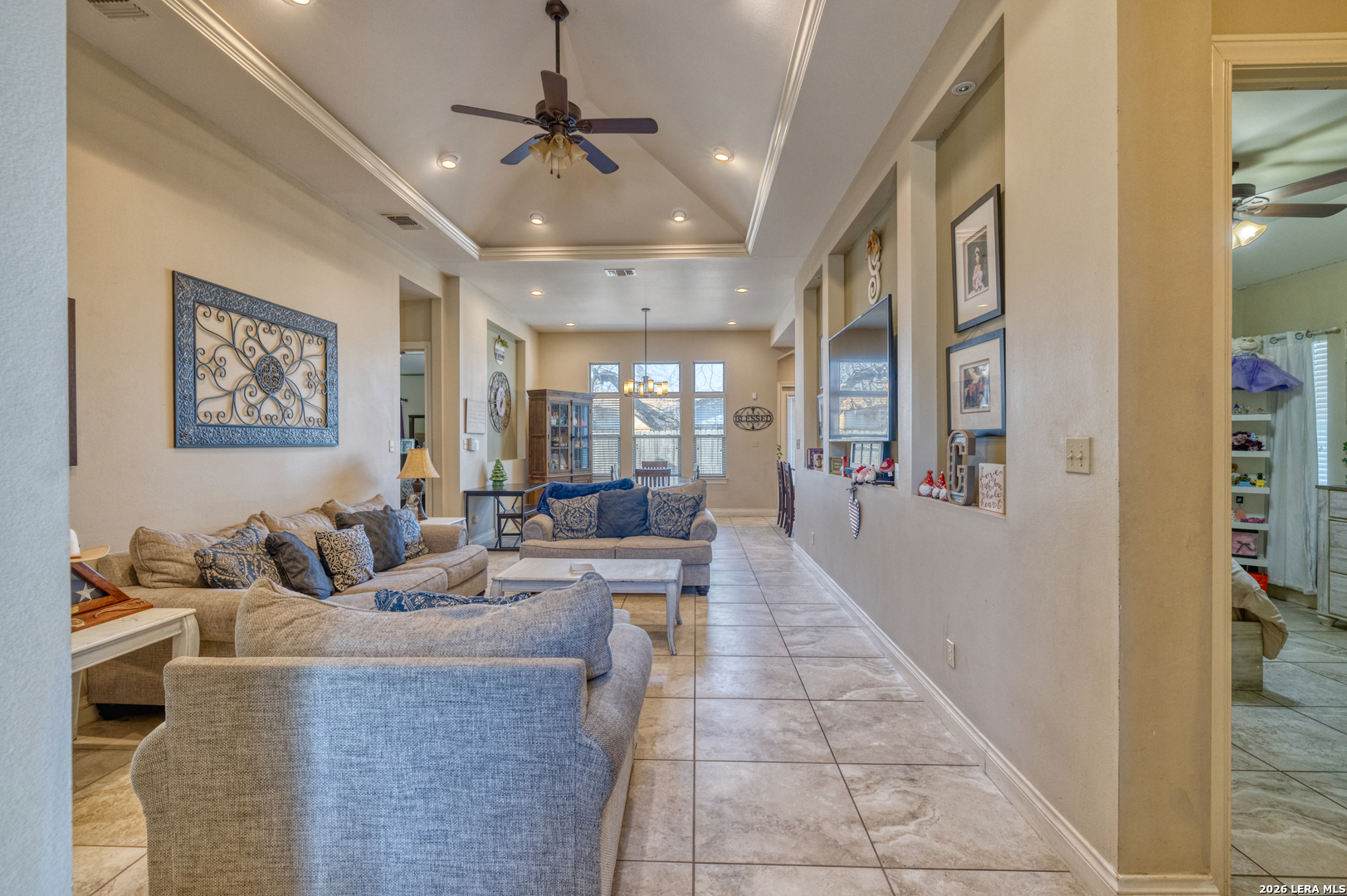 137 Sutton Place Uvalde, TX 78801 - Photo 10 of 31 a living room with furniture and a chandelier