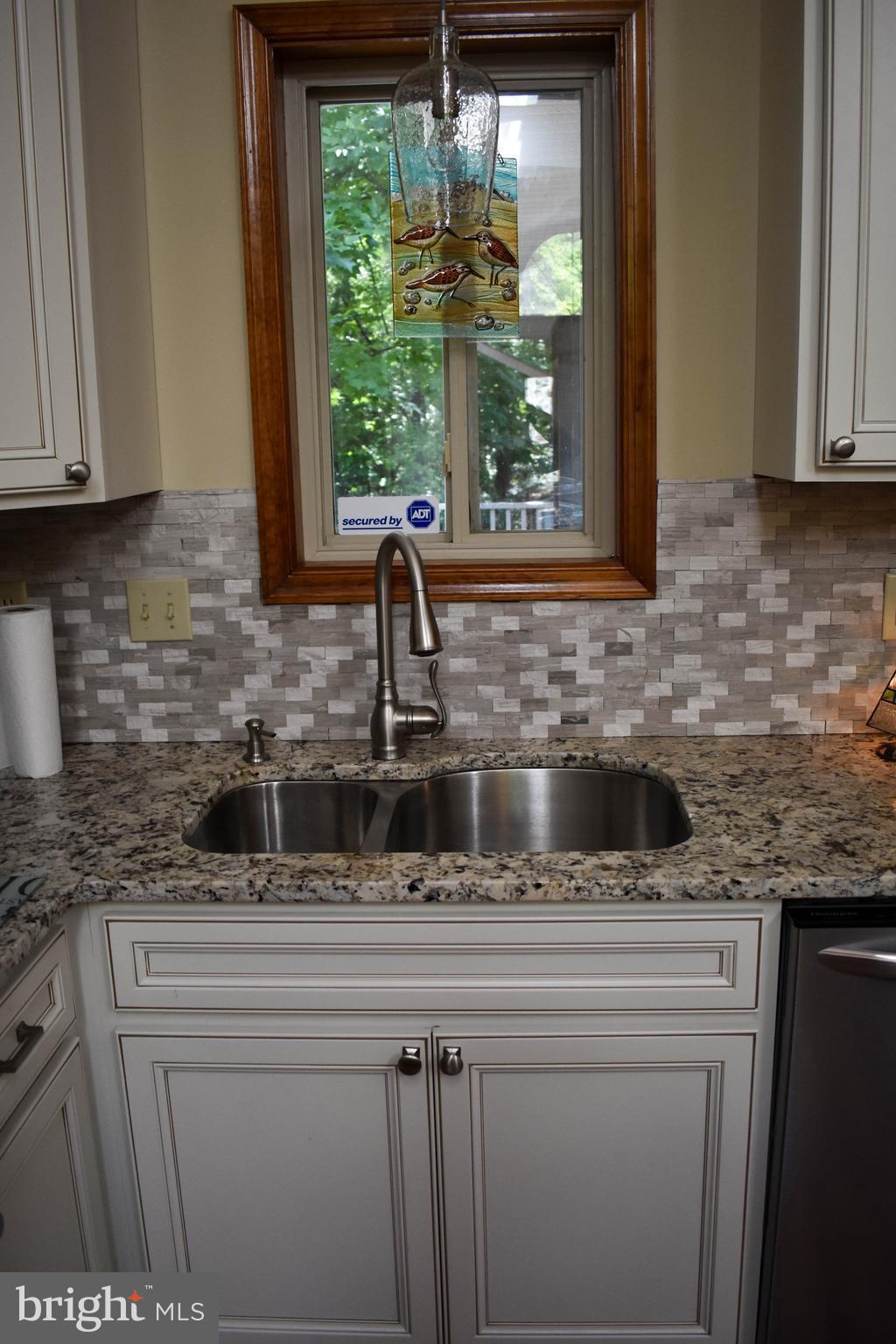 15 Sandyhook Road Ocean Pines, MD 21811 - Photo 11 of 29 a kitchen with stainless steel appliances granite countertop a sink a counter space and a wooden floor