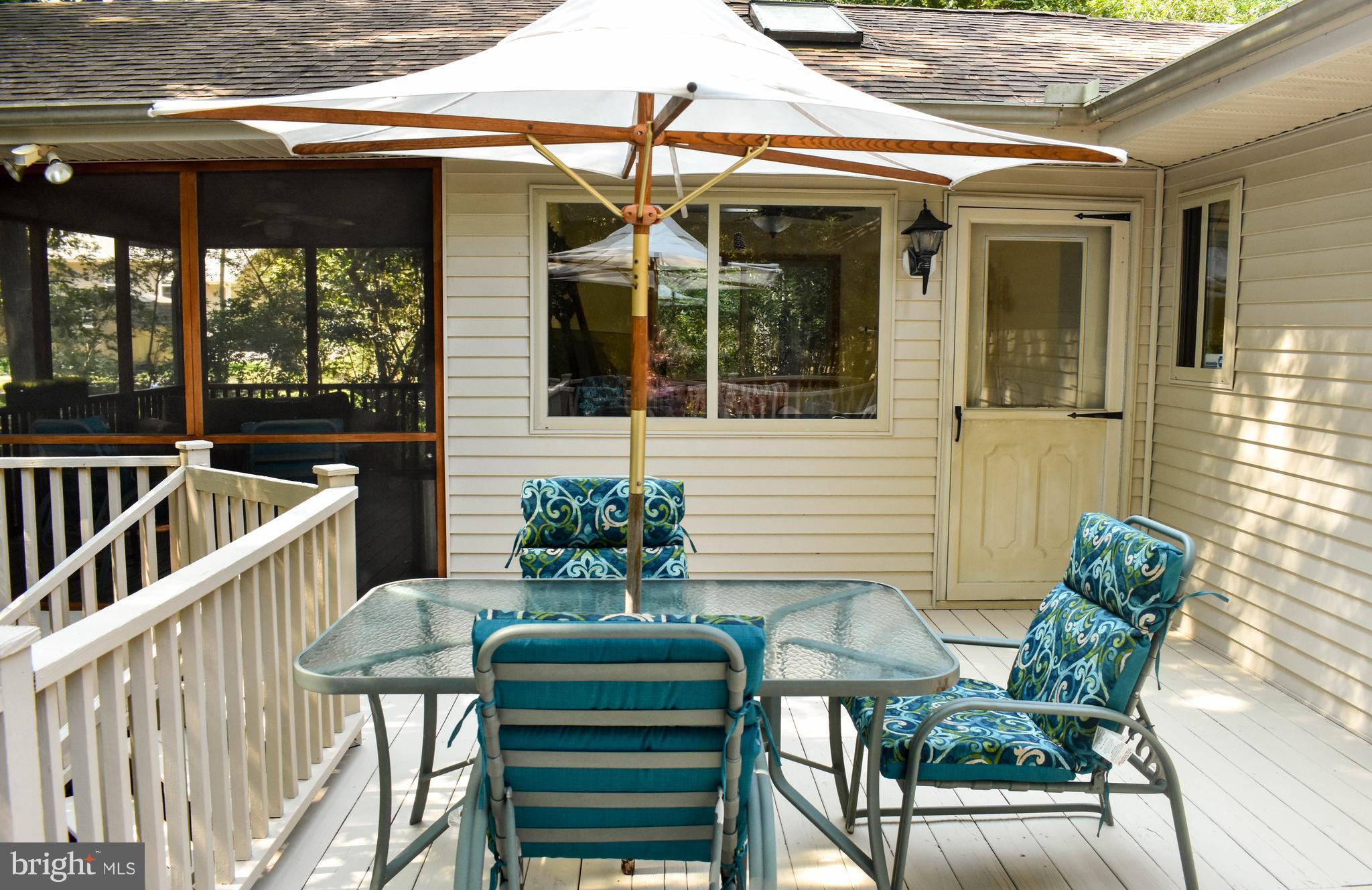 15 Sandyhook Road Ocean Pines, MD 21811 - Photo 17 of 29 a view of a patio with a table and chairs