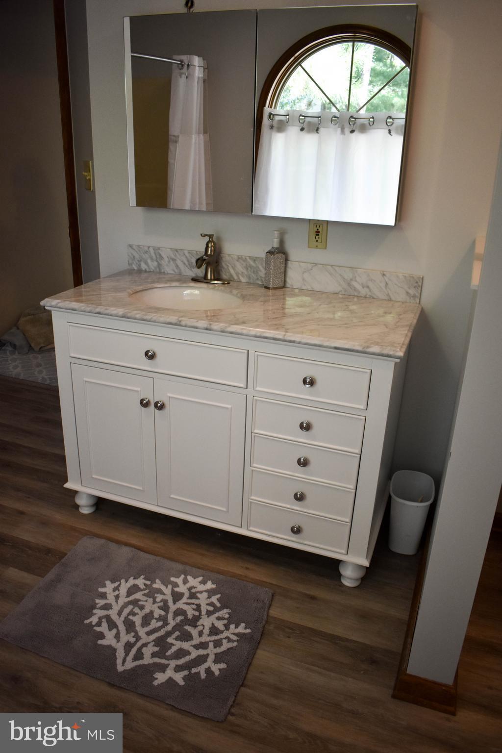 15 Sandyhook Road Ocean Pines, MD 21811 - Photo 24 of 29 a bathroom with a granite countertop sink vanity and mirror