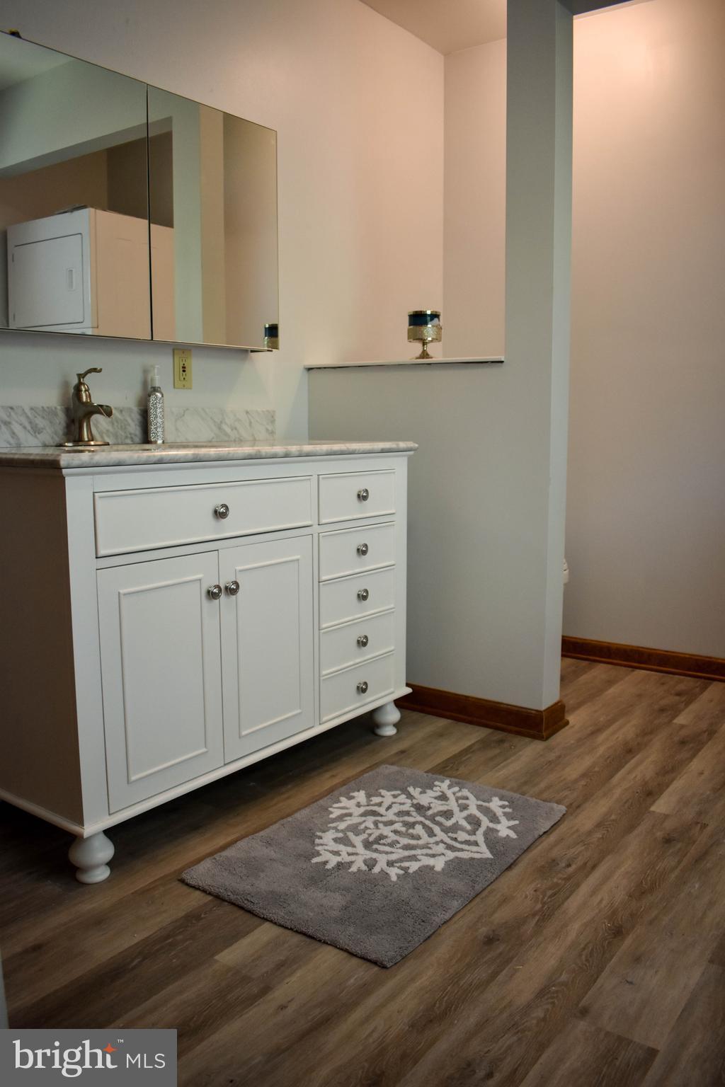 15 Sandyhook Road Ocean Pines, MD 21811 - Photo 25 of 29 a view of cabinets with wooden floor