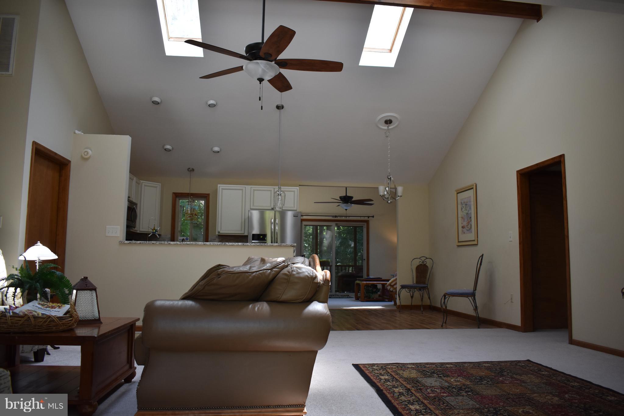 15 Sandyhook Road Ocean Pines, MD 21811 - Photo 4 of 29 a living room with furniture and a rug