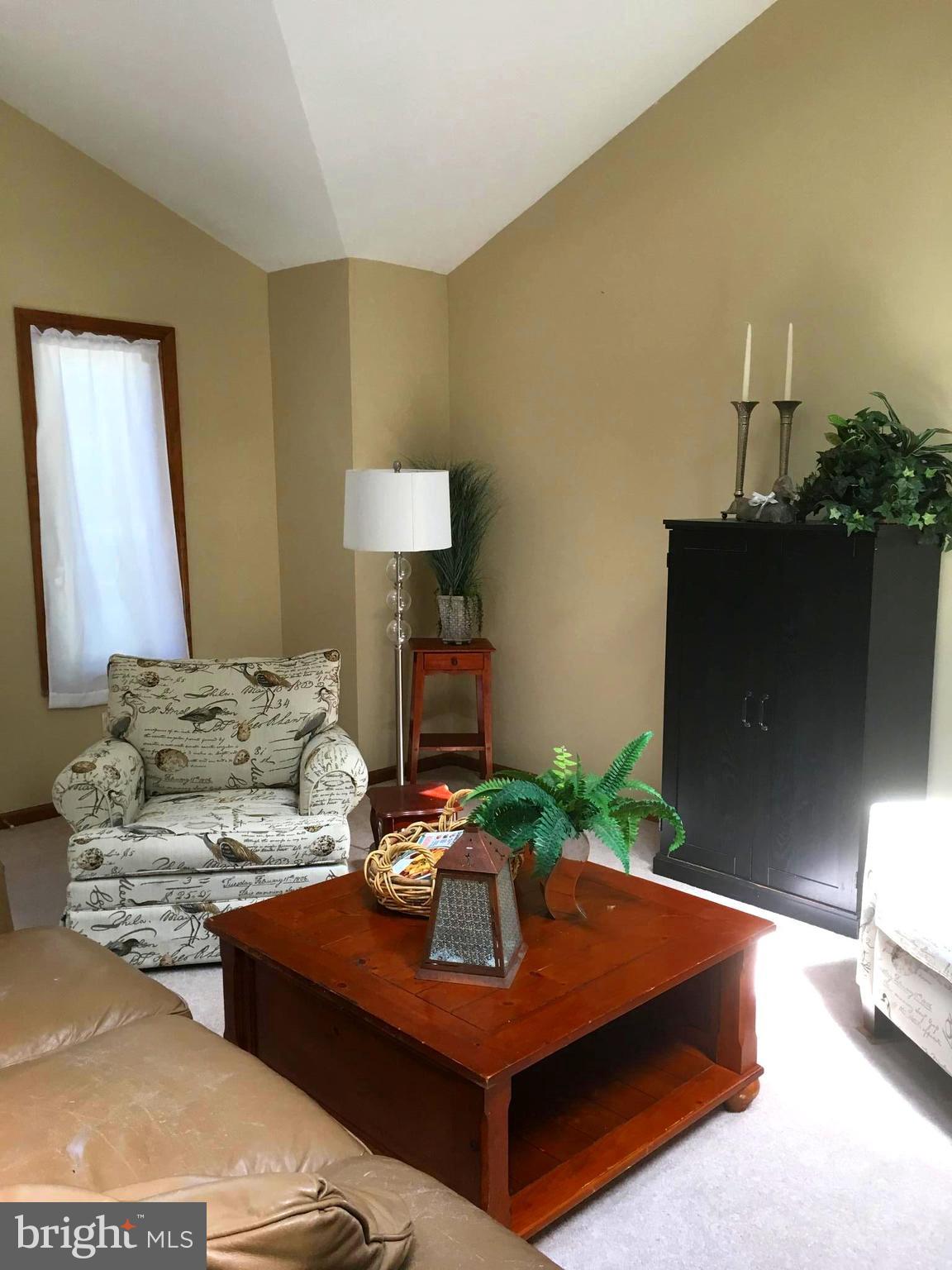 15 Sandyhook Road Ocean Pines, MD 21811 - Photo 5 of 29 a living room with furniture and a flat screen tv