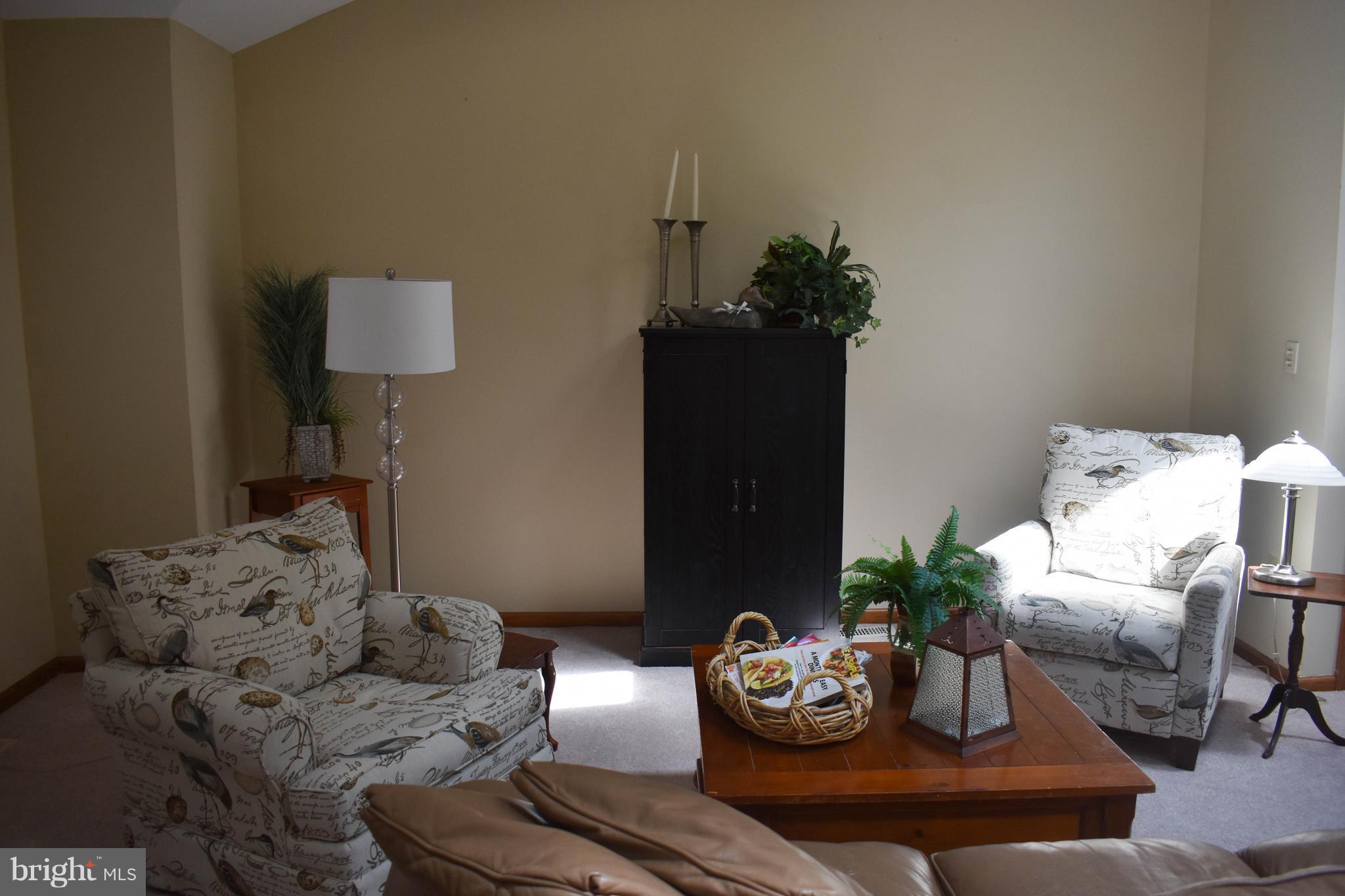 15 Sandyhook Road Ocean Pines, MD 21811 - Photo 7 of 29 a living room with furniture and a potted plant