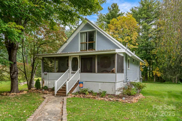 a front view of house with a garden