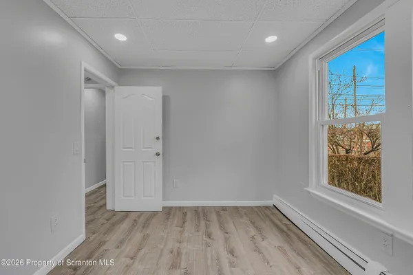 a view of an empty room with a window