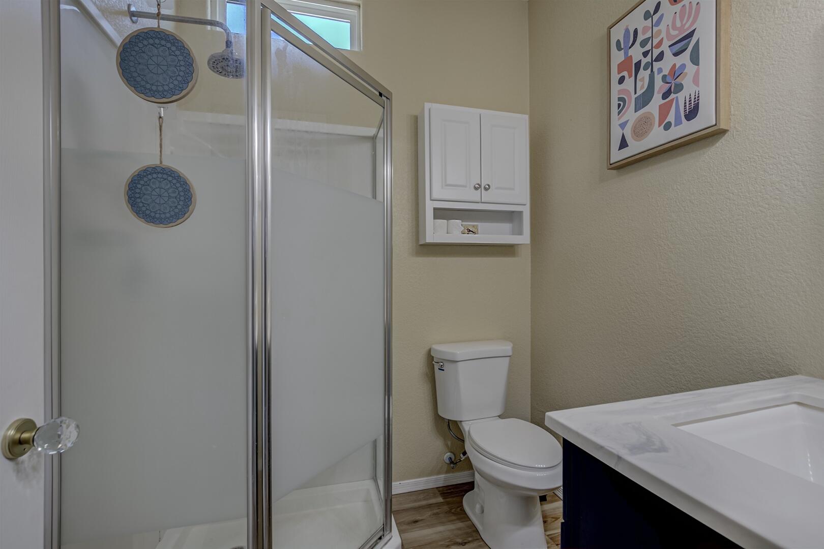 16 North Star Vale Road, Unit 122B Star Valley, AZ 85541 - Photo 14 of 21 a white toilet sitting next to a bathroom sink