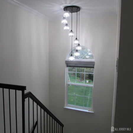 a view of a hallway with windows