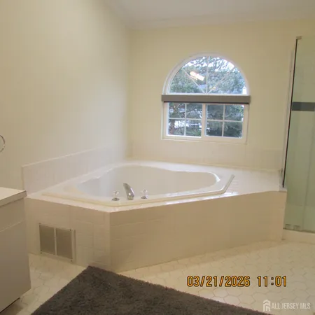 a bath tub sitting next to a window