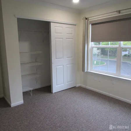 an empty room with a empty space and window