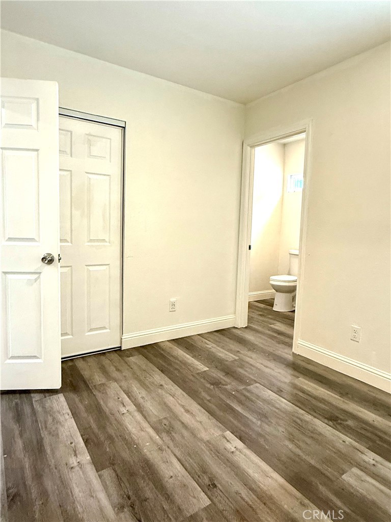 6714 Etiwanda Avenue Reseda, CA 91335 - Photo 6 of 7 a view of a room with wooden floor and bathroom
