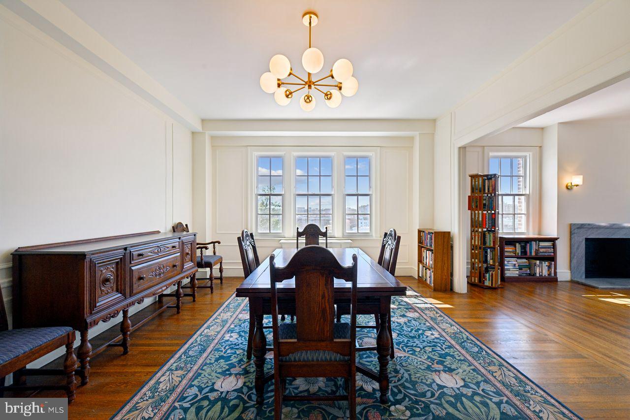 1661 Crescent Place Northwest, Unit 502 Washington, DC 20009 - Photo 23 of 50 a view of a dining room with furniture window and wooden floor