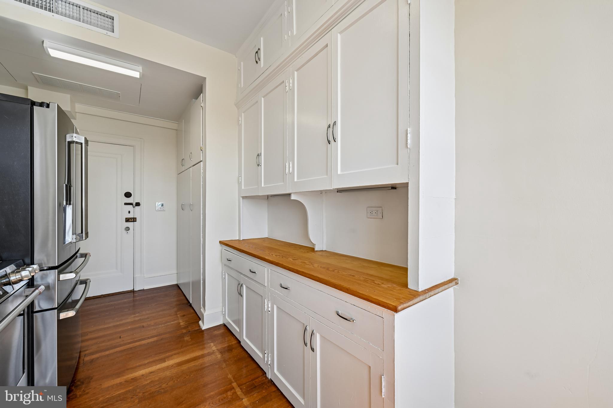 1661 Crescent Place Northwest, Unit 502 Washington, DC 20009 - Photo 26 of 50 a kitchen with white cabinets and sink