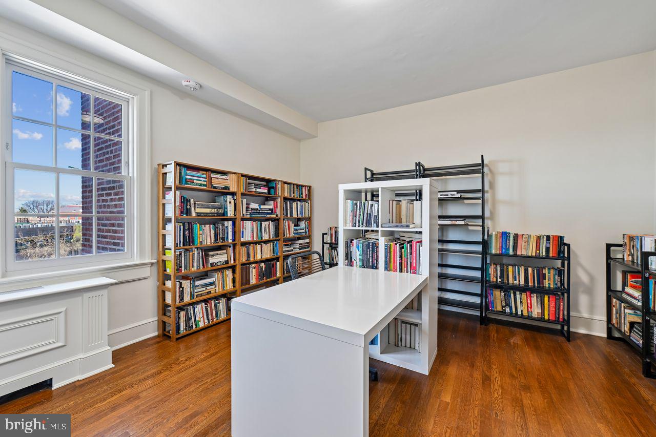 1661 Crescent Place Northwest, Unit 502 Washington, DC 20009 - Photo 29 of 50 a living room with a book shelf and a book shelf