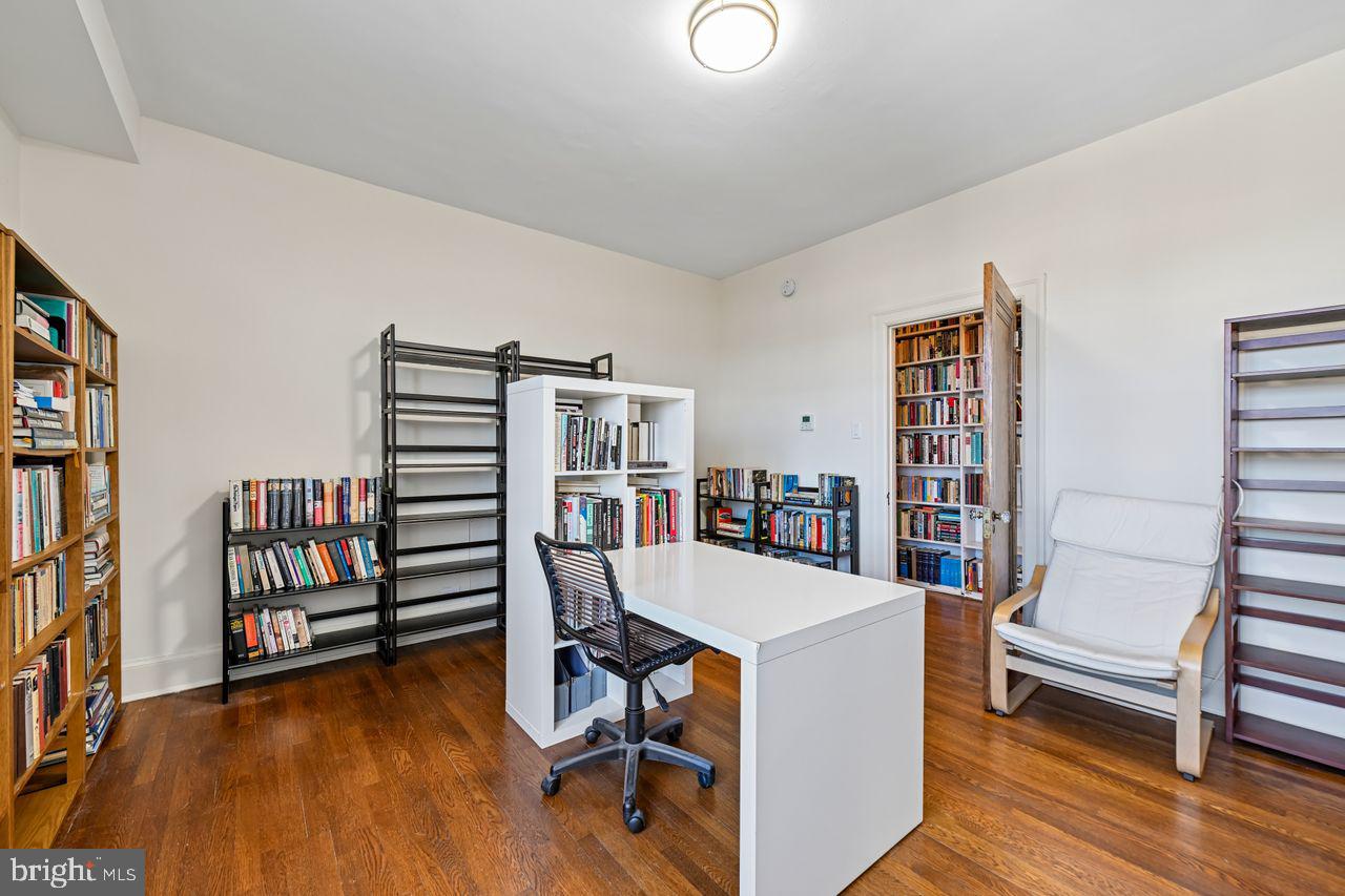 1661 Crescent Place Northwest, Unit 502 Washington, DC 20009 - Photo 30 of 50 a room with furniture and a book shelf