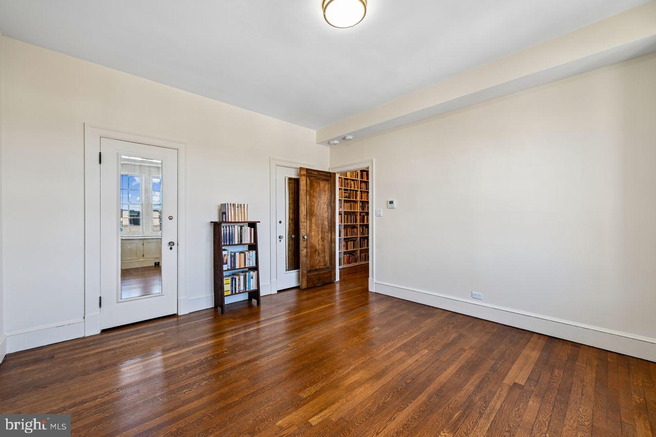 1661 Crescent Place Northwest, Unit 502 Washington, DC 20009 - Photo 34 of 50 a view of an empty room with wooden floor