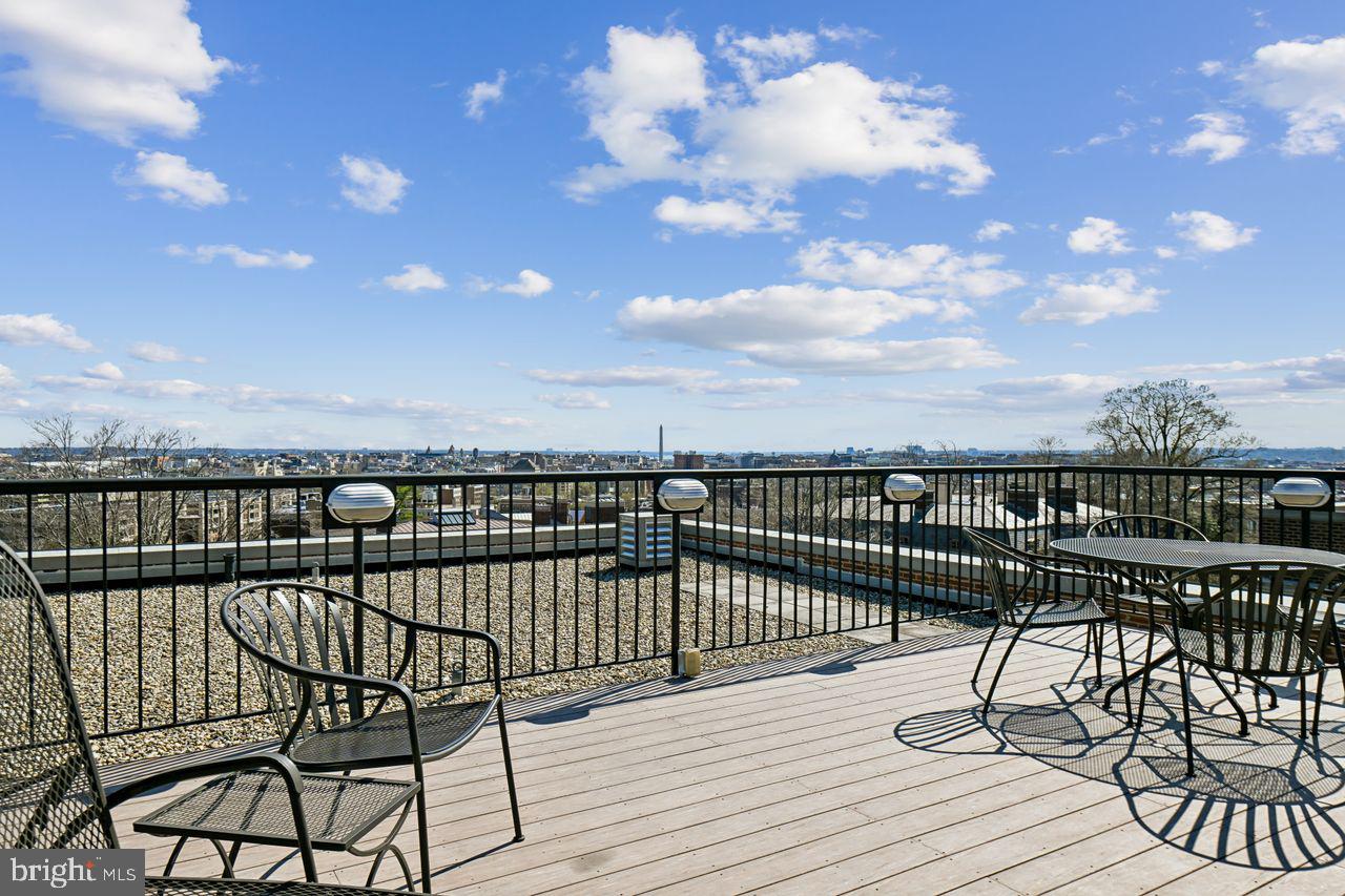 1661 Crescent Place Northwest, Unit 502 Washington, DC 20009 - Photo 38 of 50 a view of a balcony with wooden floor