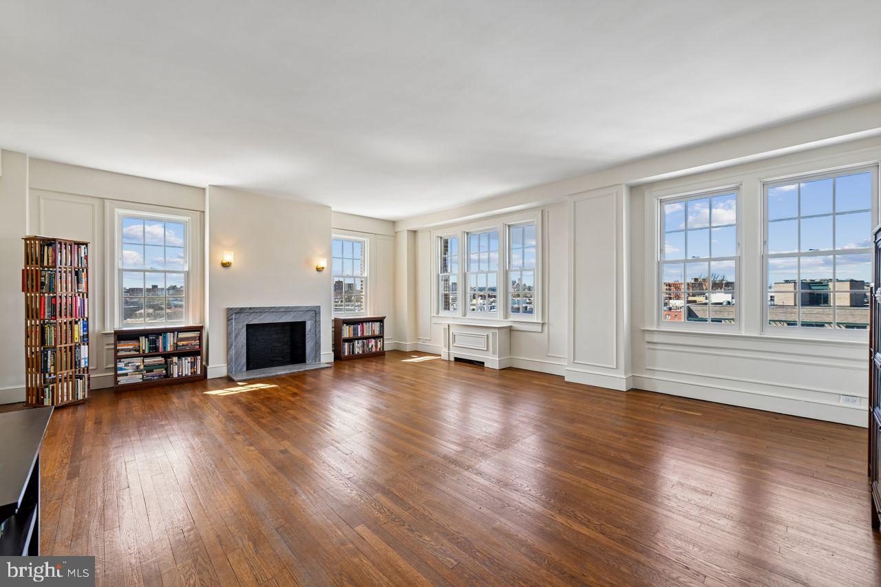 1661 Crescent Place Northwest, Unit 502 Washington, DC 20009 - Photo 4 of 50 a view of livingroom with hardwood floor and a fireplace